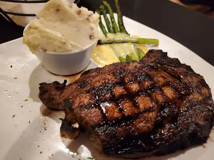 A plate of food with meat and vegetables on it.